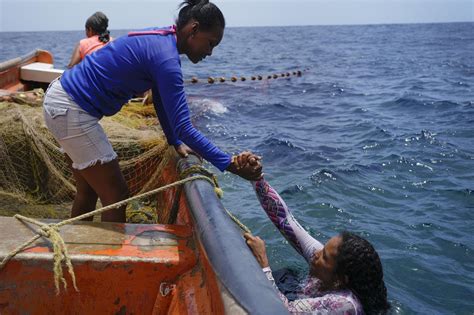 Venezuelan women are increasingly taking up the grueling work of fishing in the Caribbean